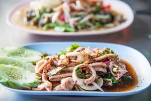 Thai spicy squid salad - Thai famous food recipe photo