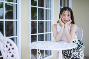 PORTRAIT Pretty woman in a restaurant, cafe with feeling happy photo