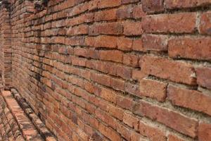 orange brick wall There are old stains, the area looks rough. photo