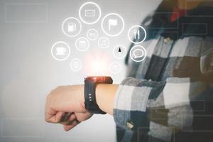 Person use smart watch to access big data on internet photo