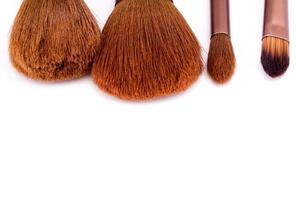 Makeup brushes on white background photo