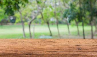 Wood table top on bokeh abstract nature background photo