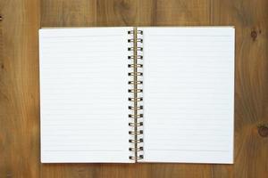 blank notebook on wooden table, business concept photo