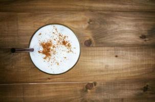 Top view Ice coffee on a wooden table photo