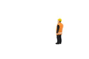 Miniature people engineer worker construction concept isolated on white background on white background photo