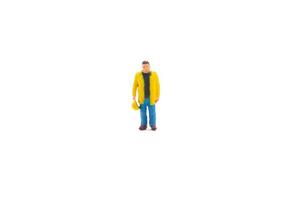 Miniature people engineer worker construction concept isolated on white background on white background photo