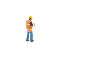 Miniature people engineer worker construction concept isolated on white background on white background photo