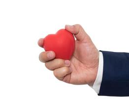 red heart in businessman hand photo