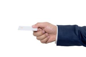 Business man handing a blank business card over white photo