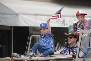 Editorial use only July 4th parade, 2022 Larkspur California USA, Corte Madera Larkspur 4th of July Parade, All American Young Child on Float 26 with Warriors Hat on photo