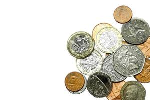 Top view and crop of British currency coins isolate on white background. photo