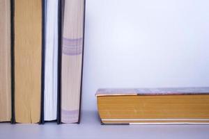 Books on a gray table in a bookstore on a gray background. photo