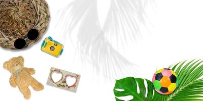 accessories composition for summer concept with tropical palm leaves on white background, top view and copy space photo