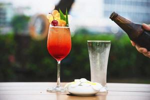 People celebration in restaurant with beer and mai tai or mai thai - happy lifestyle people with happy drink in garden concept photo