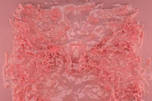 3d illustration of pink liquid cream drops splash . pink design element photo