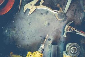 Many Tools on grunge table.View from above. Copy space. photo