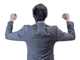 backview of businessman standing with hands up. photo