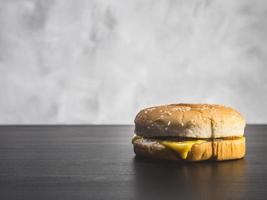Hamburger  on the table over a grunge background. photo