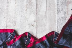 Top view of Tablecloth on wooden table background, Free space for text photo