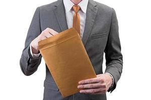 Businessman holding an envelope  isolated on white background. photo