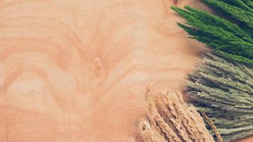 Top view of whet crop on wooden table background. photo