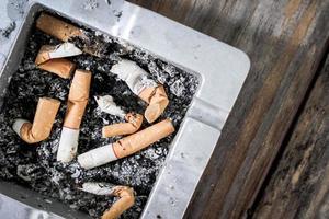 Smoked Cigarettes Butts in ashtray photo