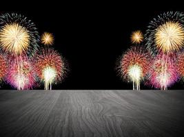 Empty wooden table in front of fireworks background. photo