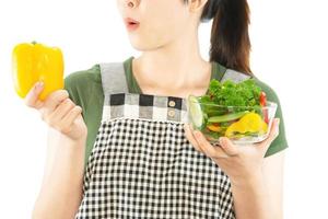 Happy lady holding kichen stuff over copy space background - people home made food preparation concept photo