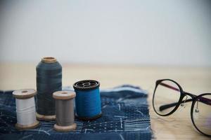 Vintage embroidery set on wooden table background - handmade diy background concept photo