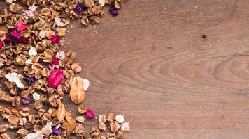 Top view workspace with dried flowers on wooden table background .Free space for your text. photo