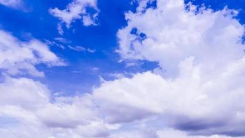 Blue sky background with white clouds photo