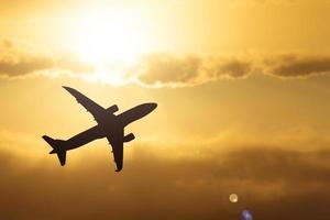 Silhouette of a passenger plane in the sky. Travel and travel ideas around the world. photo