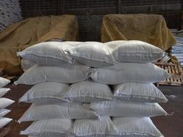 Chemical fertilizer The product stock is packed in sacks, stacked in the warehouse, waiting for delivery. photo