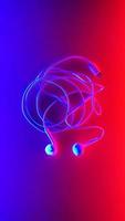 Earphones, Earbud type white color and Cloud symbol made from cable isolated on blue and red gradient background, with copy space photo
