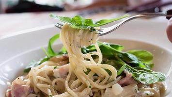Spaghetti carbonara recipe - famous Italian dish food for background use photo