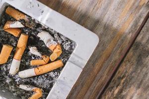 Smoked Cigarettes Butts in ashtray photo