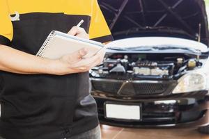 Mechanic man checking a car photo