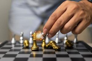 Hand man holding chess in game.Idea planning strategy marketing business concept. photo