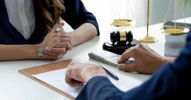 Close-up shot, A male client giving a house loan payment or mortgage fees to his female real estate agent. Property Investment concept photo