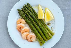 Cooked asparagus with prawn photo