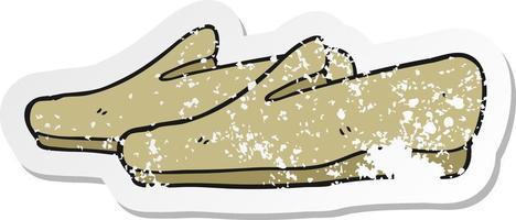 pegatina retro angustiada de unas zapatillas de dibujos animados vector