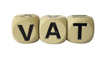 vat spelling on a wooden cube photo