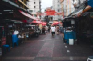 blur abstract background people shopping festival market. photo