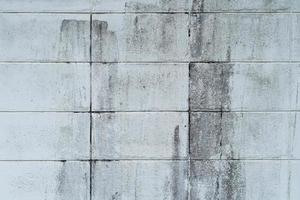 Gray Concrete block wall background and textured with dirty. photo