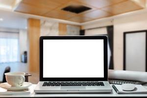 Front view workspace with computer, smartphone and tablet on white desk with blurred background photo