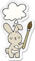 cartoon rabbit with paint brush and thought bubble as a printed sticker vector