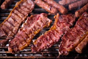 delicious grilled meat on barbecue photo