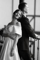 young couple bride and groom in a white short dress photo