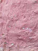 Pink stone rough old wall spray painted texture concrete background in retro style with copy space photo