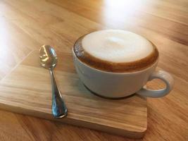 Hot cappuccino coffee in coffee shop photo